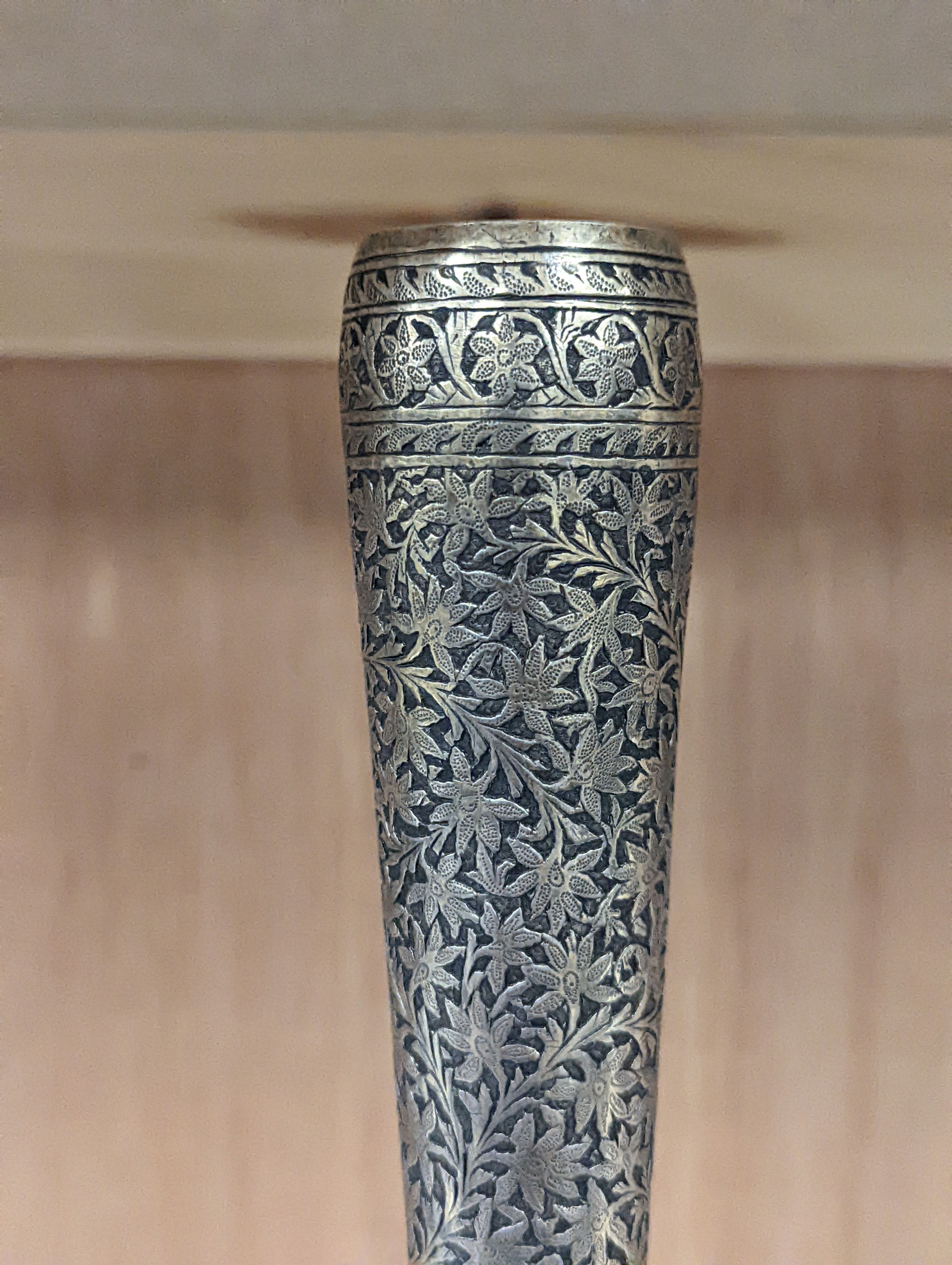 A 19th century North Indian silver surahi with engraved shawl decoration 30cm